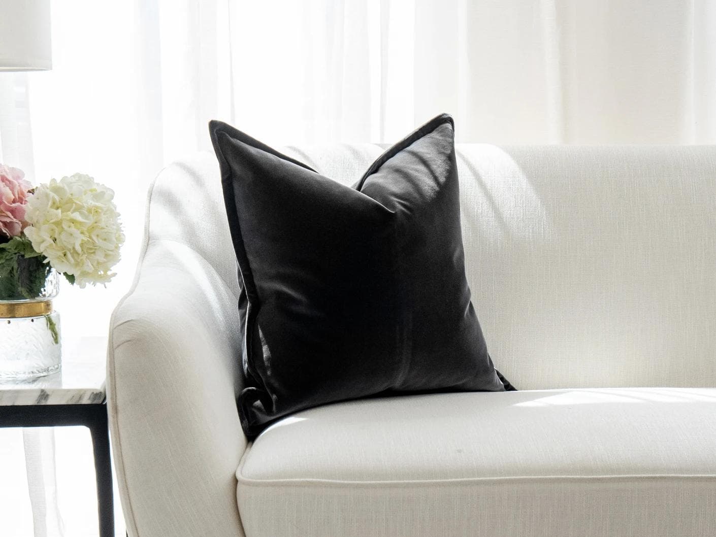 Alessandra Steele cushion in charcoal and grey, shown in a lifestyle front view as image 6