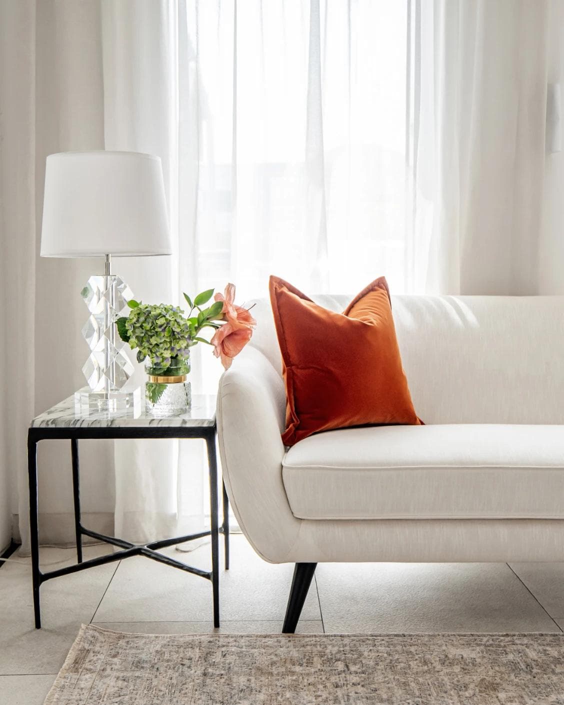 Alessandra Tangelo cushion in orange, shown in a lifestyle front view as image 4