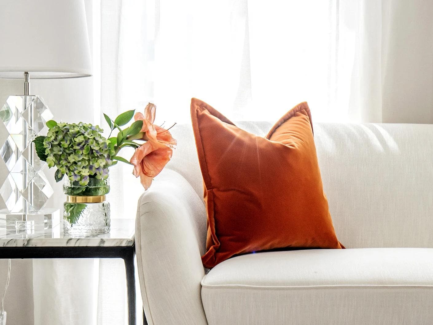 Alessandra Tangelo cushion in orange, shown in a lifestyle front view as image 5