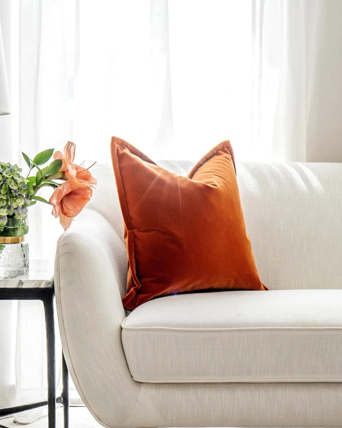 Alessandra Tangelo cushion in orange, shown in a lifestyle front view as image 5