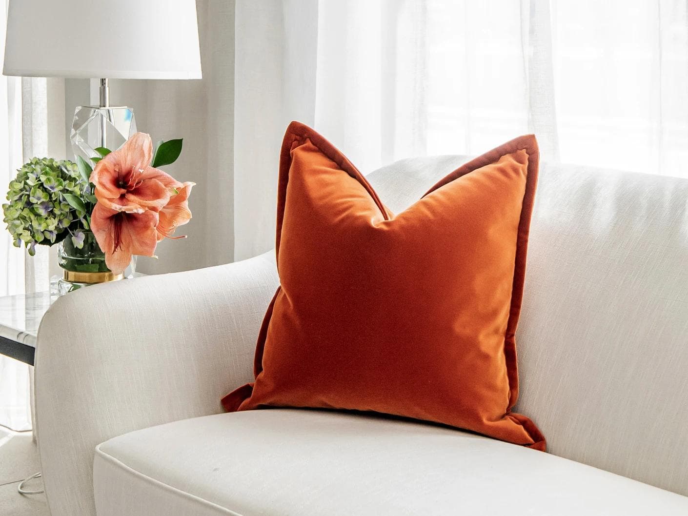 Alessandra Tangelo cushion in orange, shown in a lifestyle right view as image 2