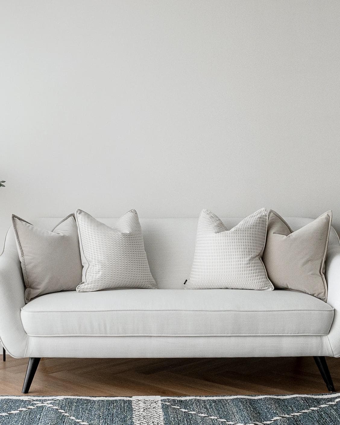 Alex Bundle cushion in beige and white, shown in a lifestyle front view as image 4