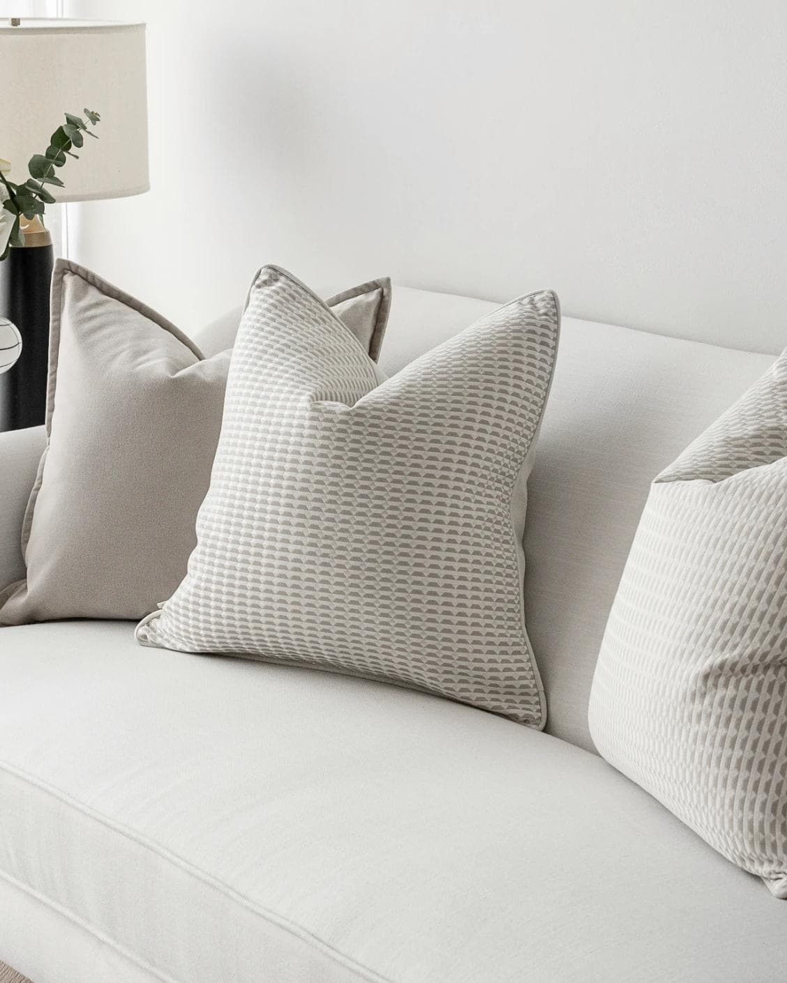 Alex Bundle cushion in beige and white, shown in a lifestyle right view as image 5