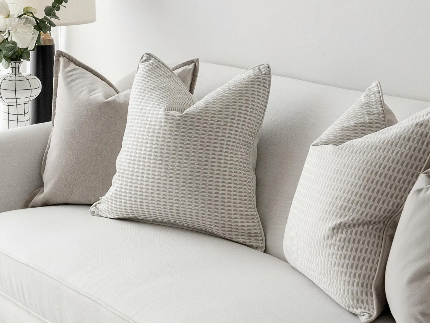Alex Bundle cushion in beige and white, shown in a lifestyle right view as image 5