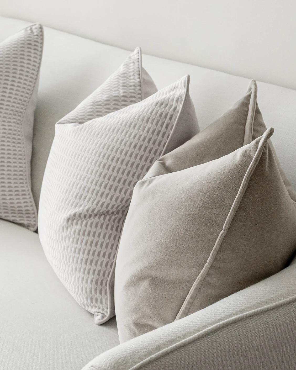 Alex Bundle cushion in beige and white, shown in a lifestyle right view as image 6