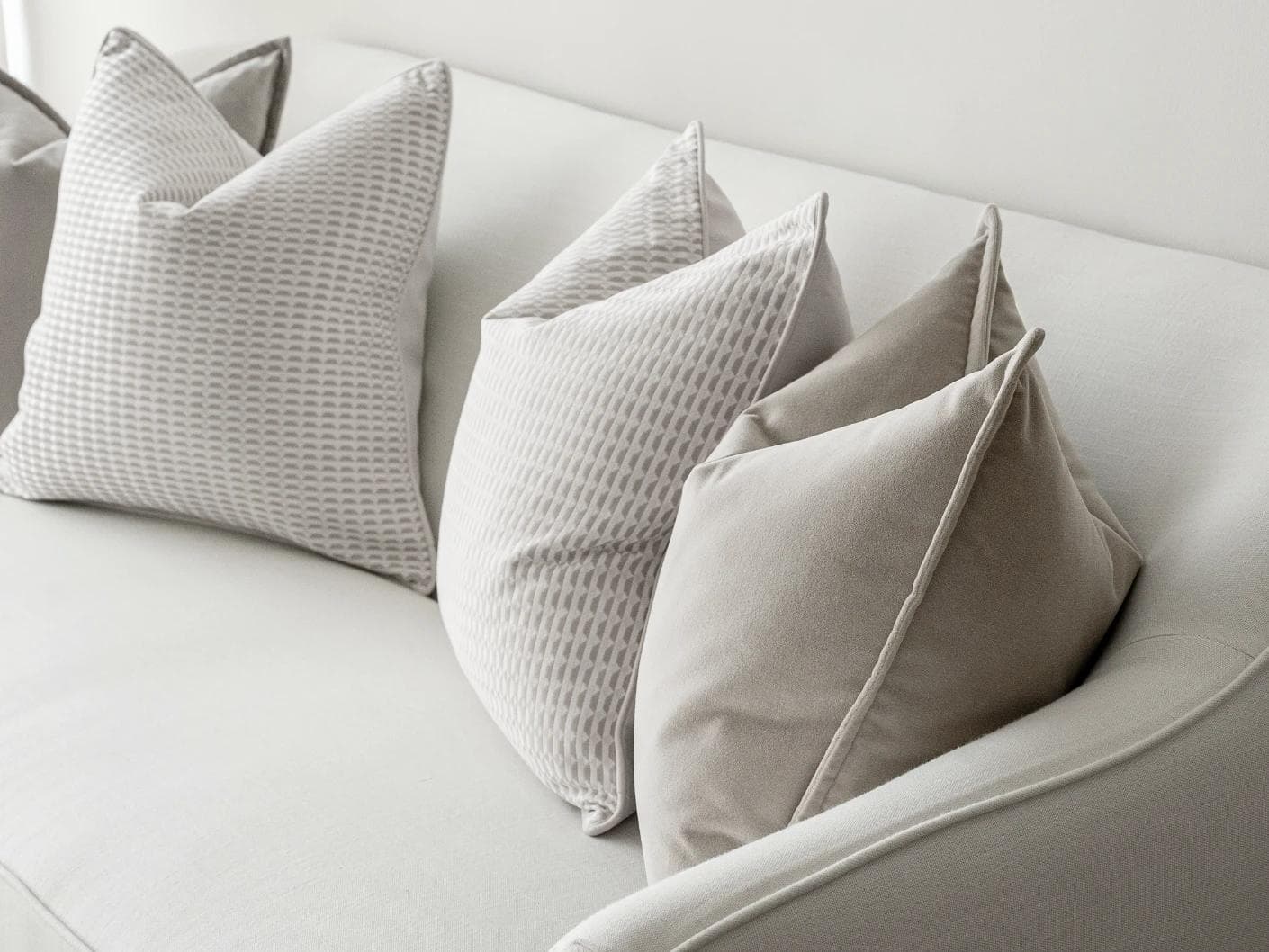 Alex Bundle cushion in beige and white, shown in a lifestyle right view as image 6