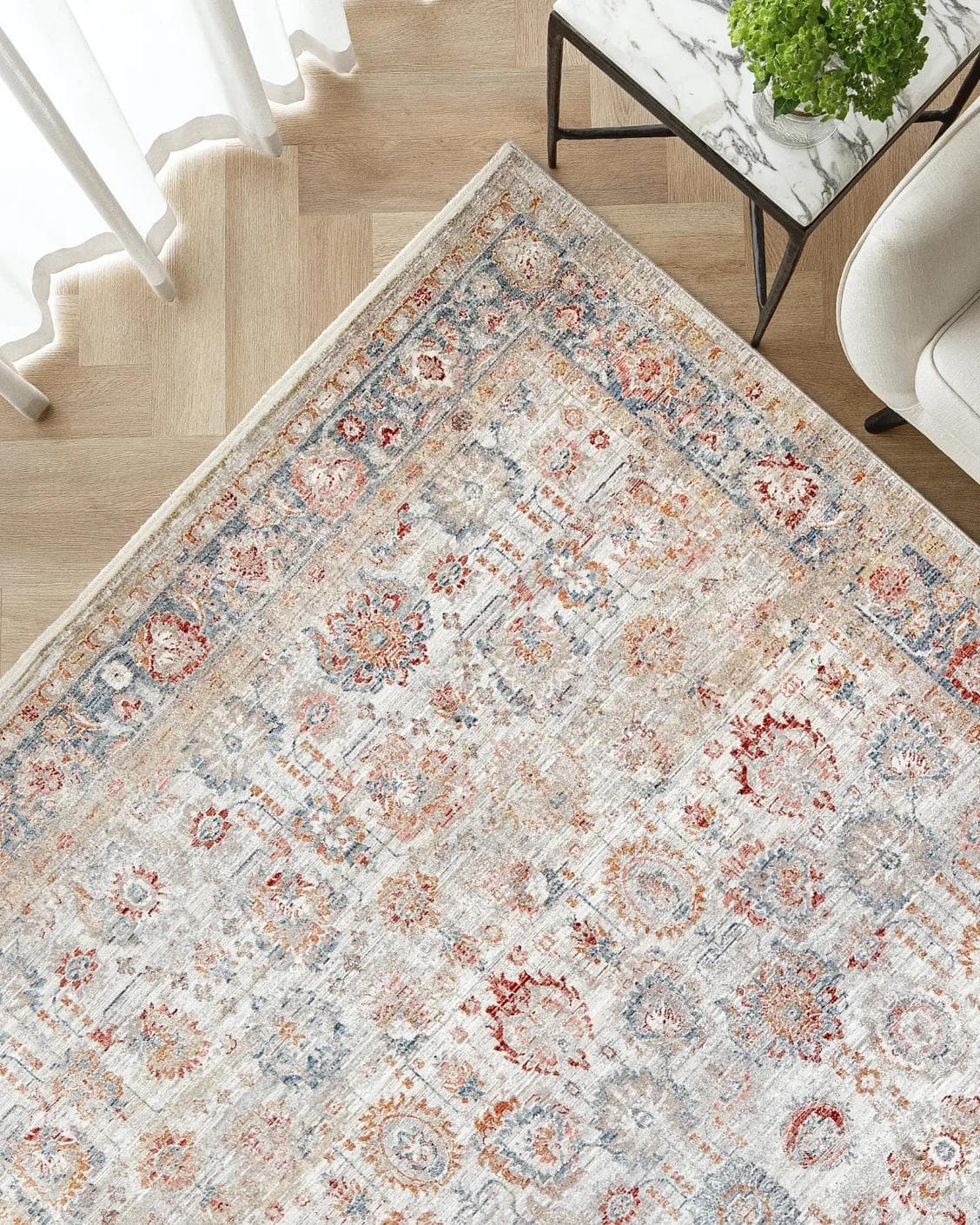 Alexander Sandy carpet in beige and red, shown in a lifestyle top view as image 2