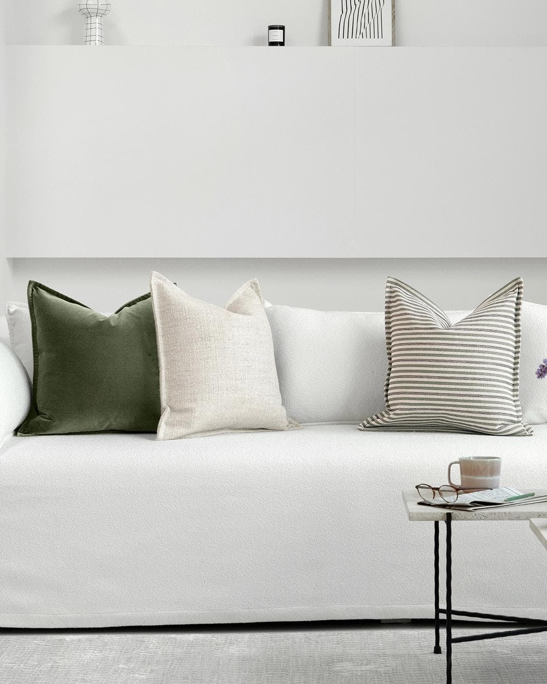 Aliva Bundle cushion in ivory, green and off white, shown in a lifestyle front view as image 4
