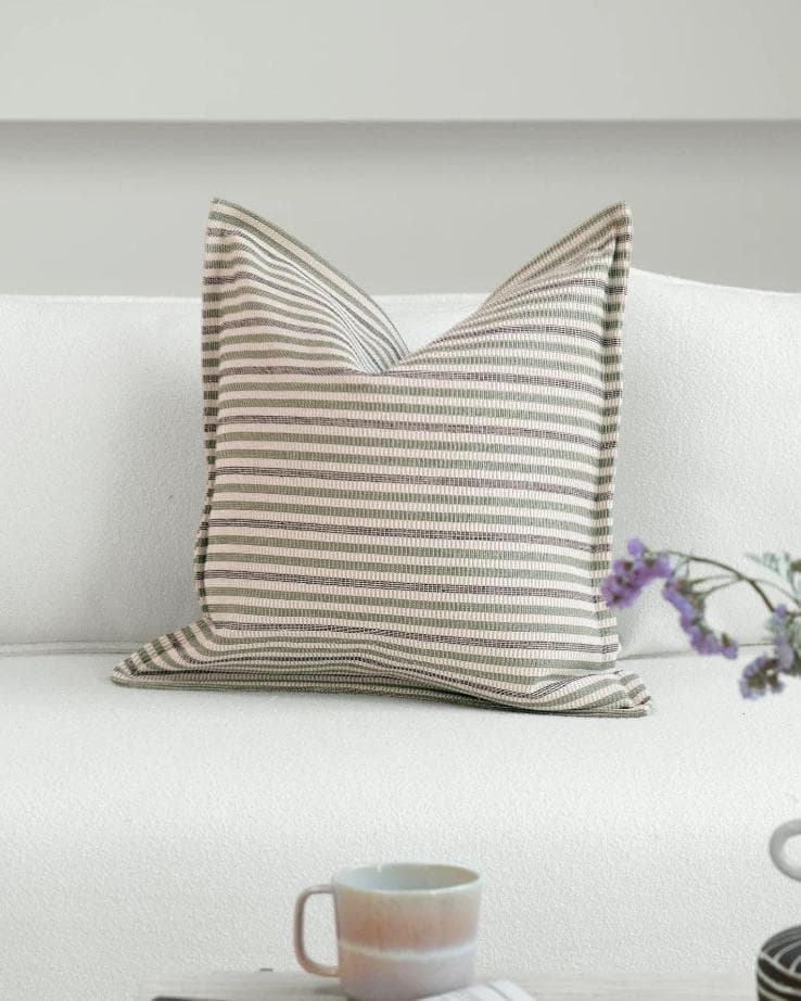 Aliva Bundle cushion in ivory, green and off white, shown in a lifestyle front view as image 5