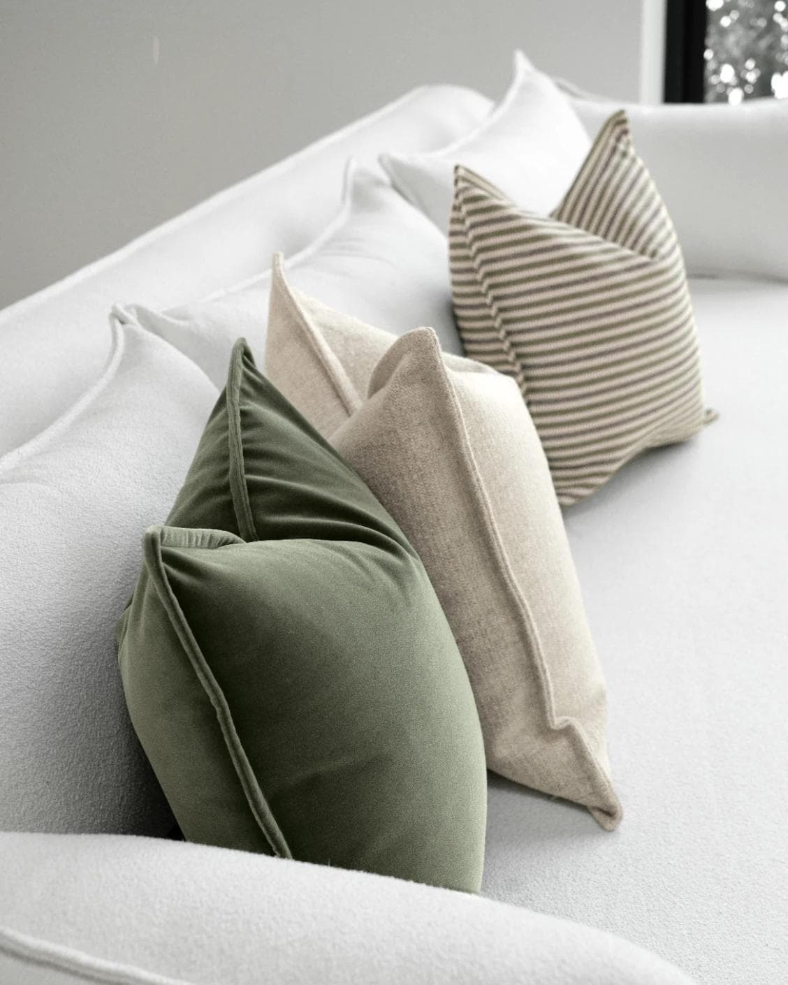 Aliva Bundle cushion in ivory, green and off white, shown in a lifestyle left view as image 7