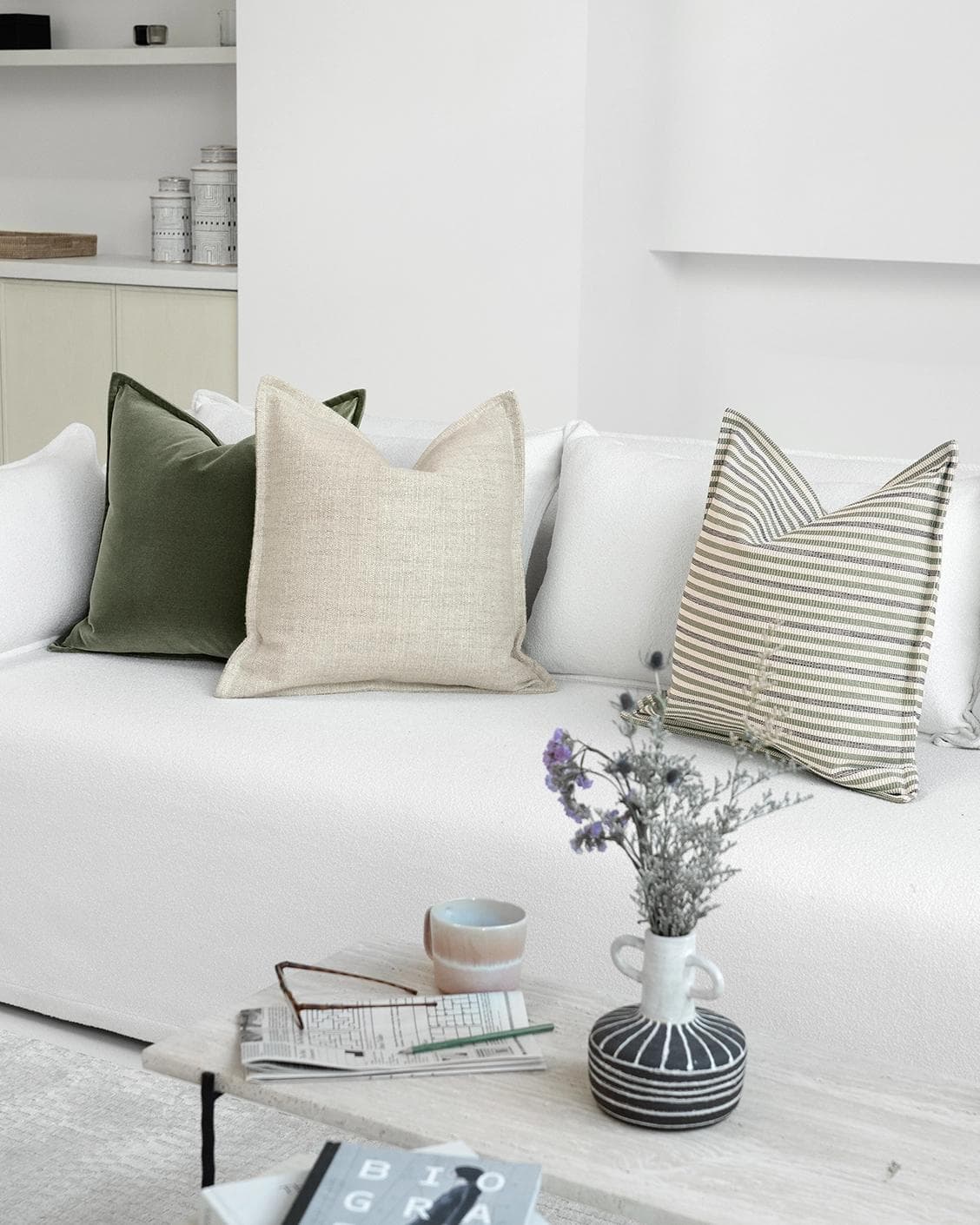 Aliva Bundle cushion in ivory, green and off white, shown in a lifestyle right view as image 2