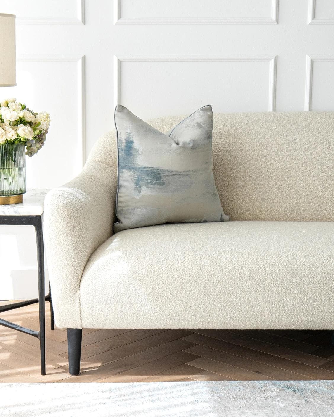 Alma Canova cushion in blue and silver, shown in a lifestyle front view as image 4