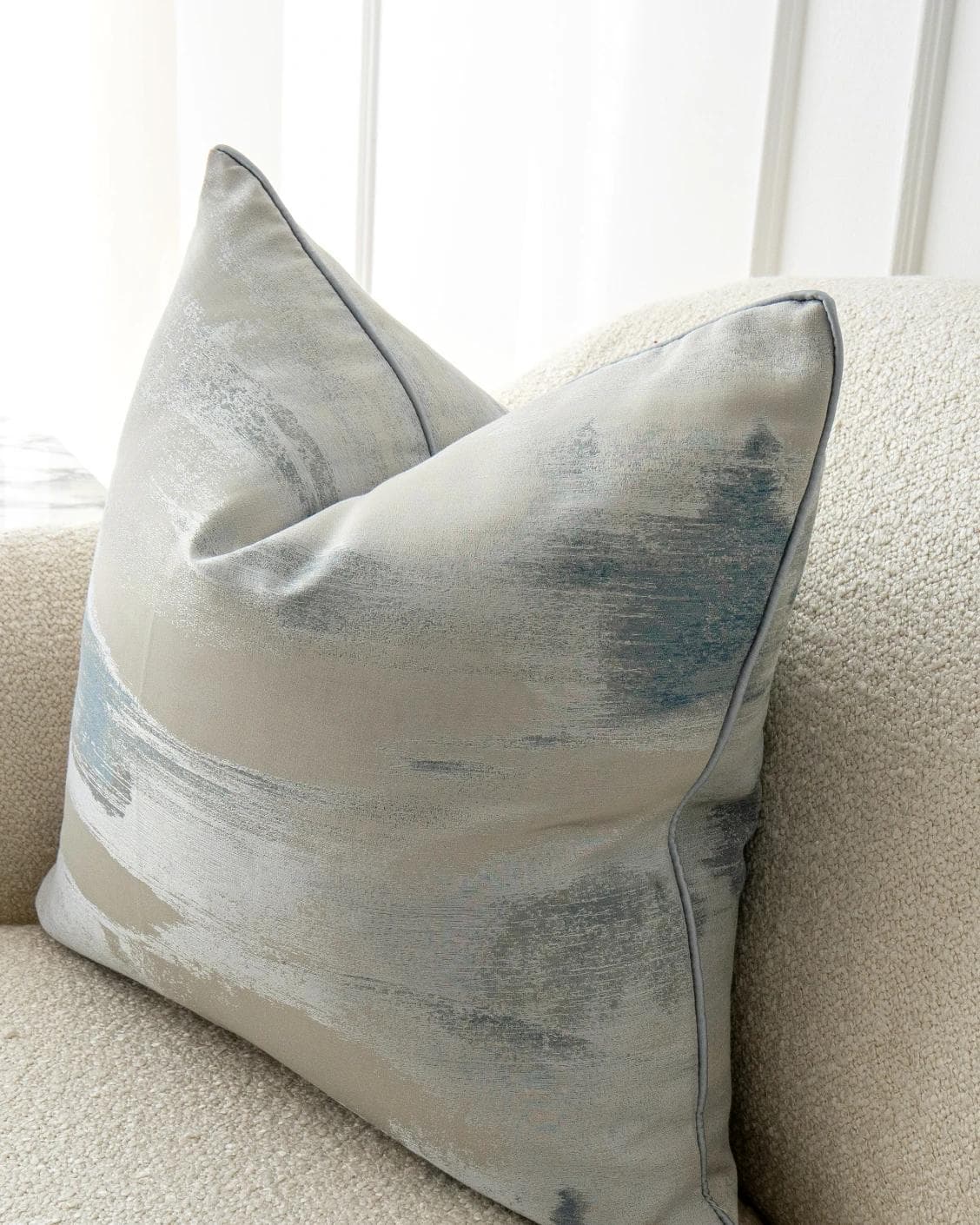 Alma Canova cushion in blue and silver, shown in a lifestyle as image 6