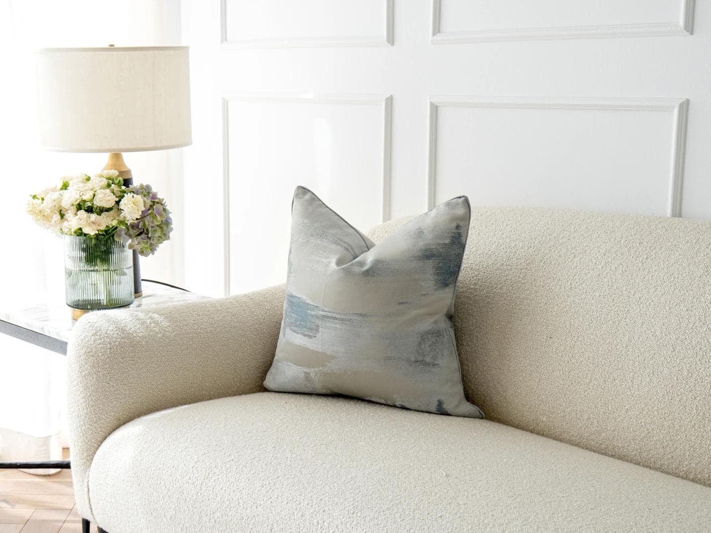 Alma Canova cushion in blue and silver, shown in a lifestyle right view as image 2