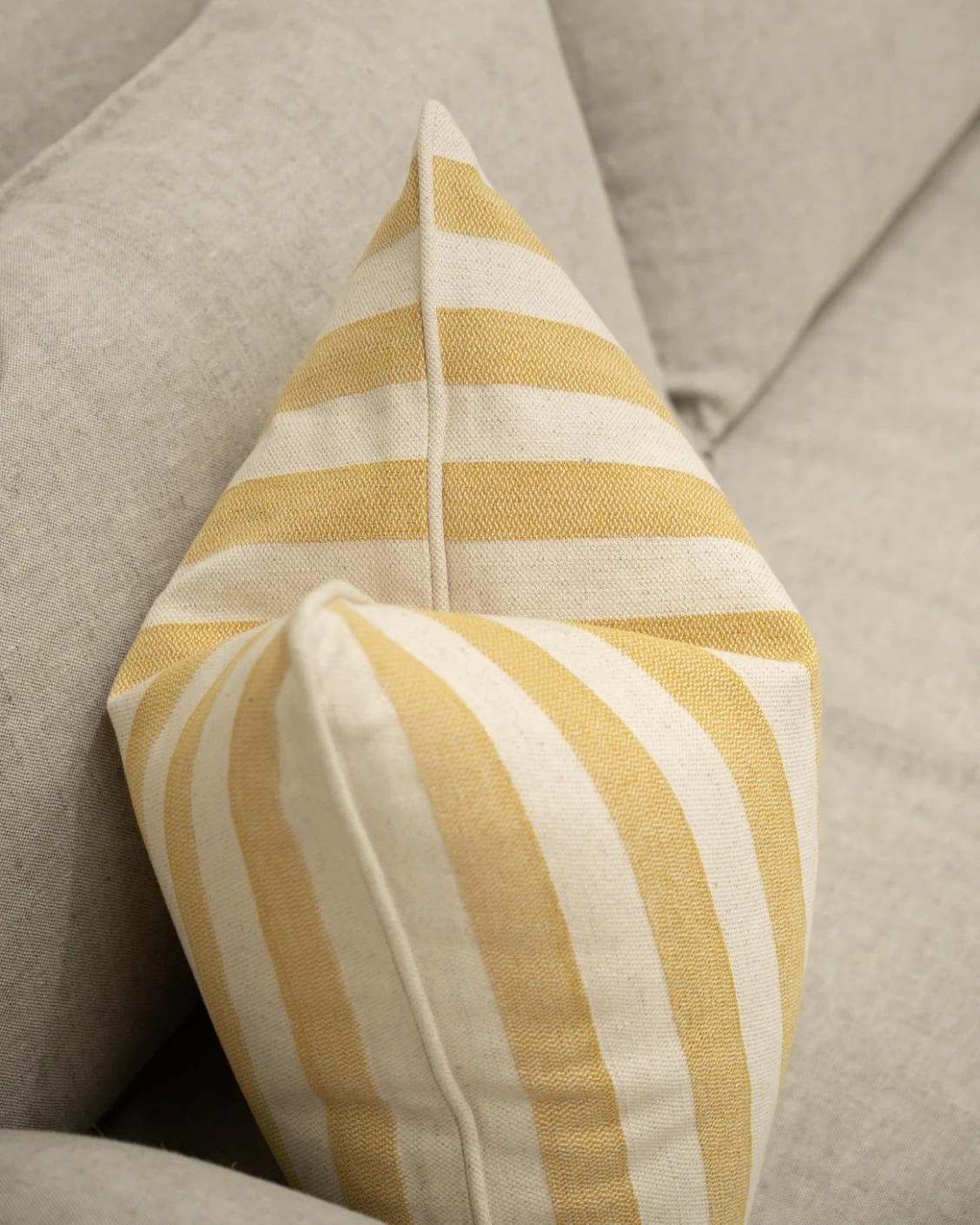 Ameline Barrymore cushion in yellow, shown in a lifestyle top view as image 4