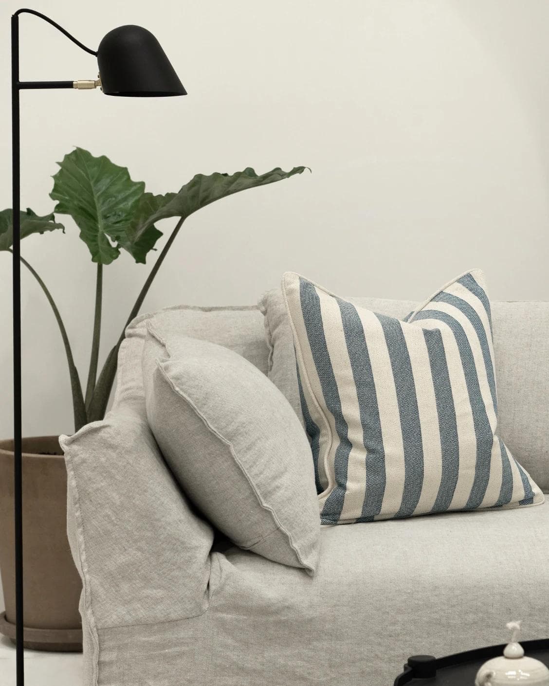 Ameline Canova cushion in blue, shown in a lifestyle front view as image 4
