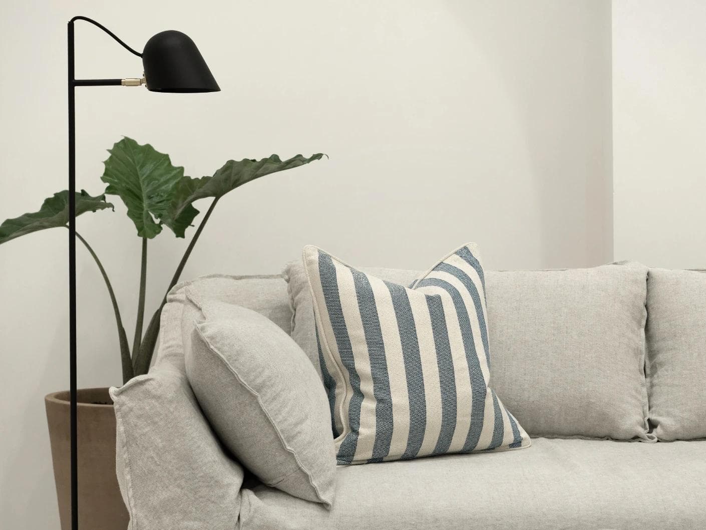 Ameline Canova cushion in blue, shown in a lifestyle front view as image 4