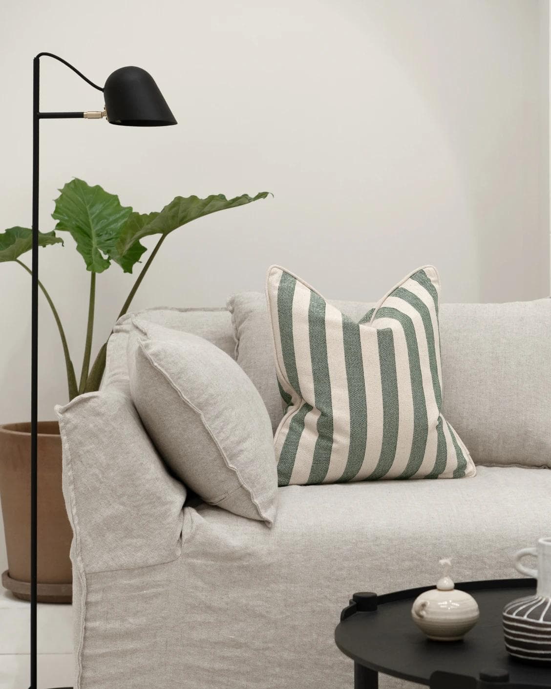 Ameline Forest cushion in forest green, shown in a lifestyle front view as image 4