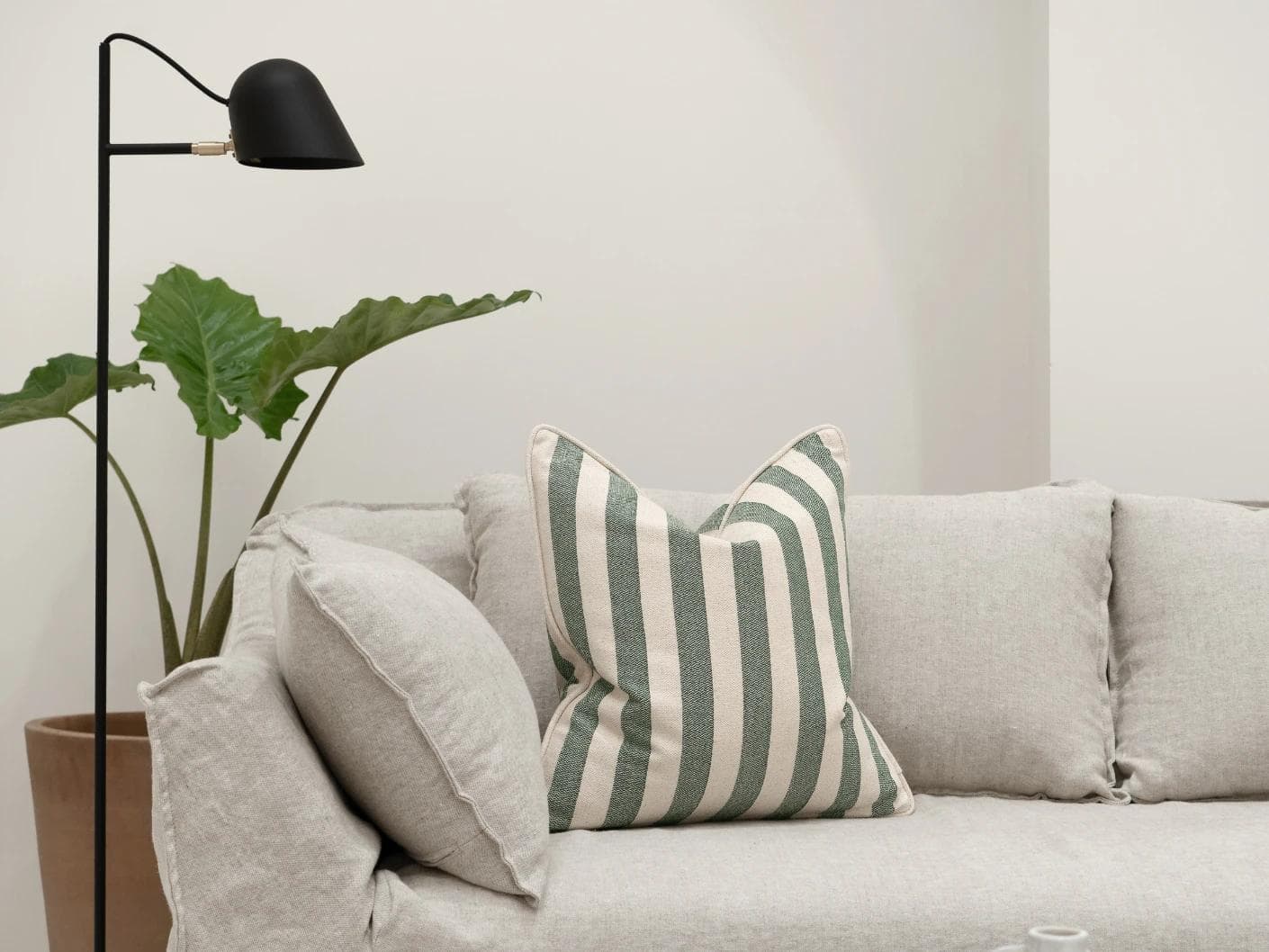 Ameline Forest cushion in forest green, shown in a lifestyle front view as image 4