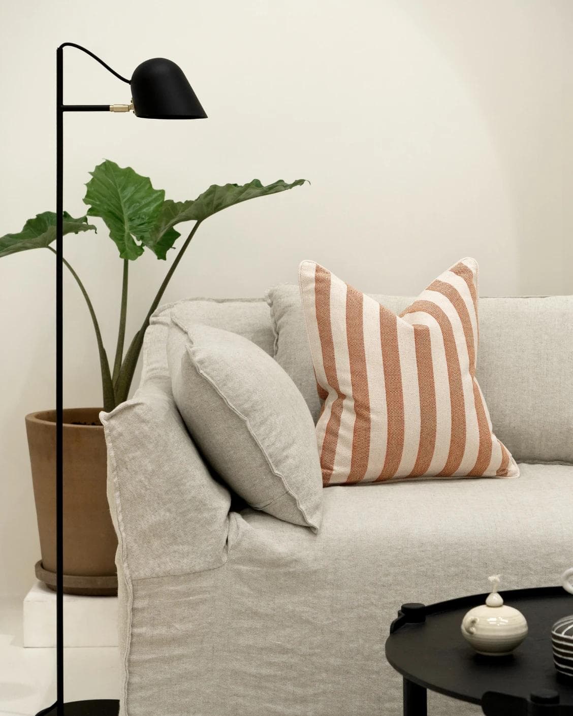 Ameline Rust cushion, shown in a lifestyle front view as image 4