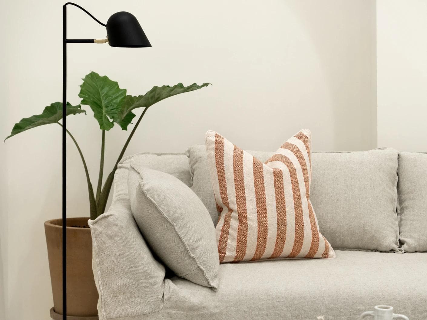 Ameline Rust cushion, shown in a lifestyle front view as image 4