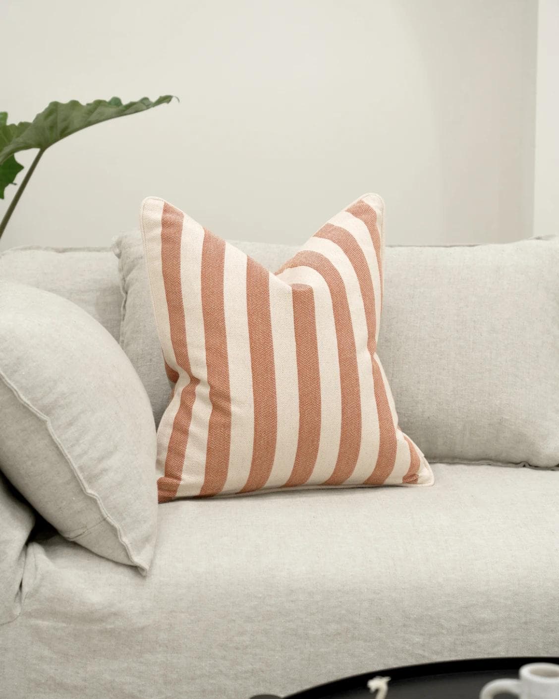 Ameline Rust cushion, shown in a lifestyle front view as image 5