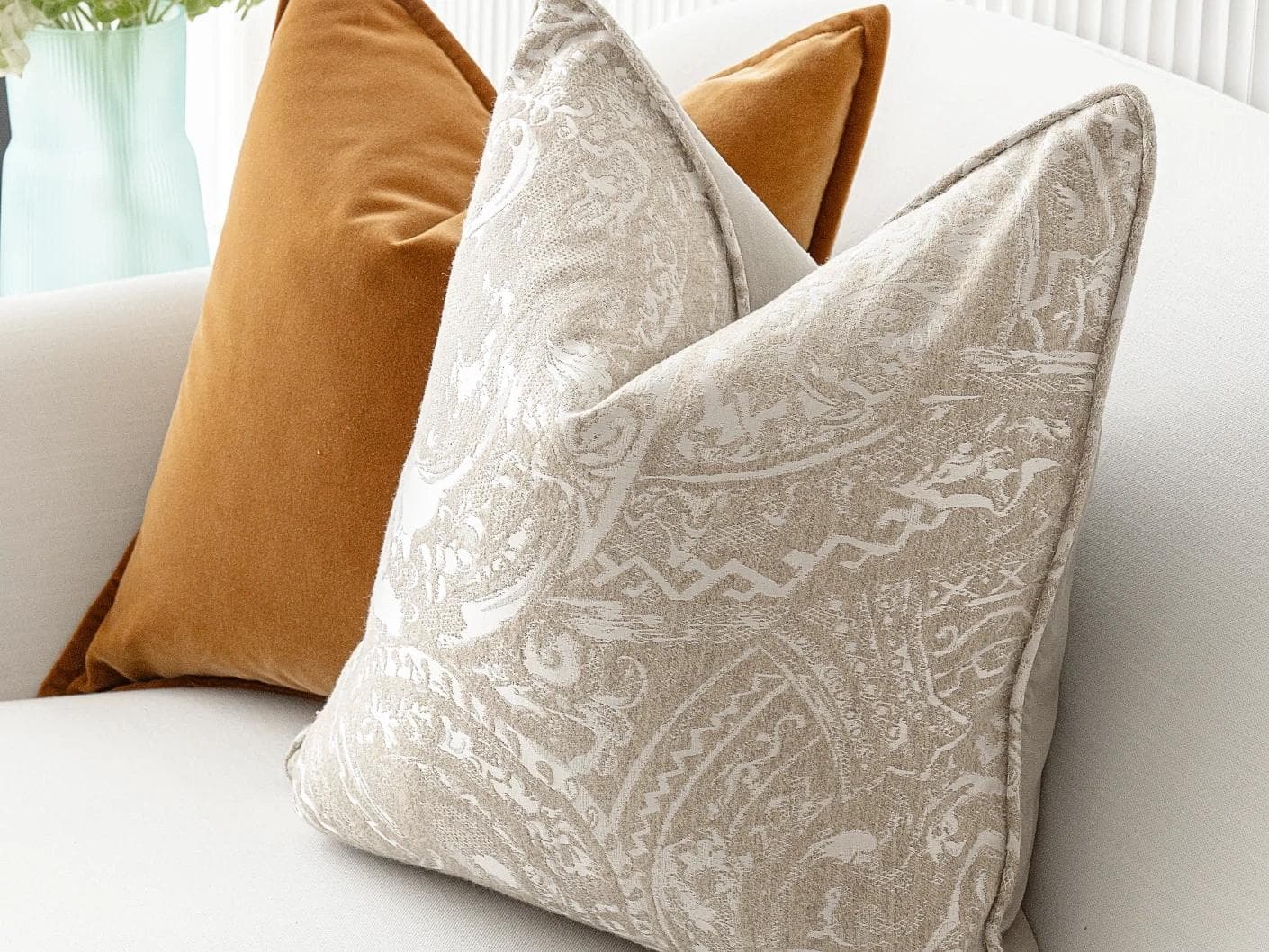 Amiya Bundle cushion in orange, beige and silver, shown in a lifestyle right view as image 7