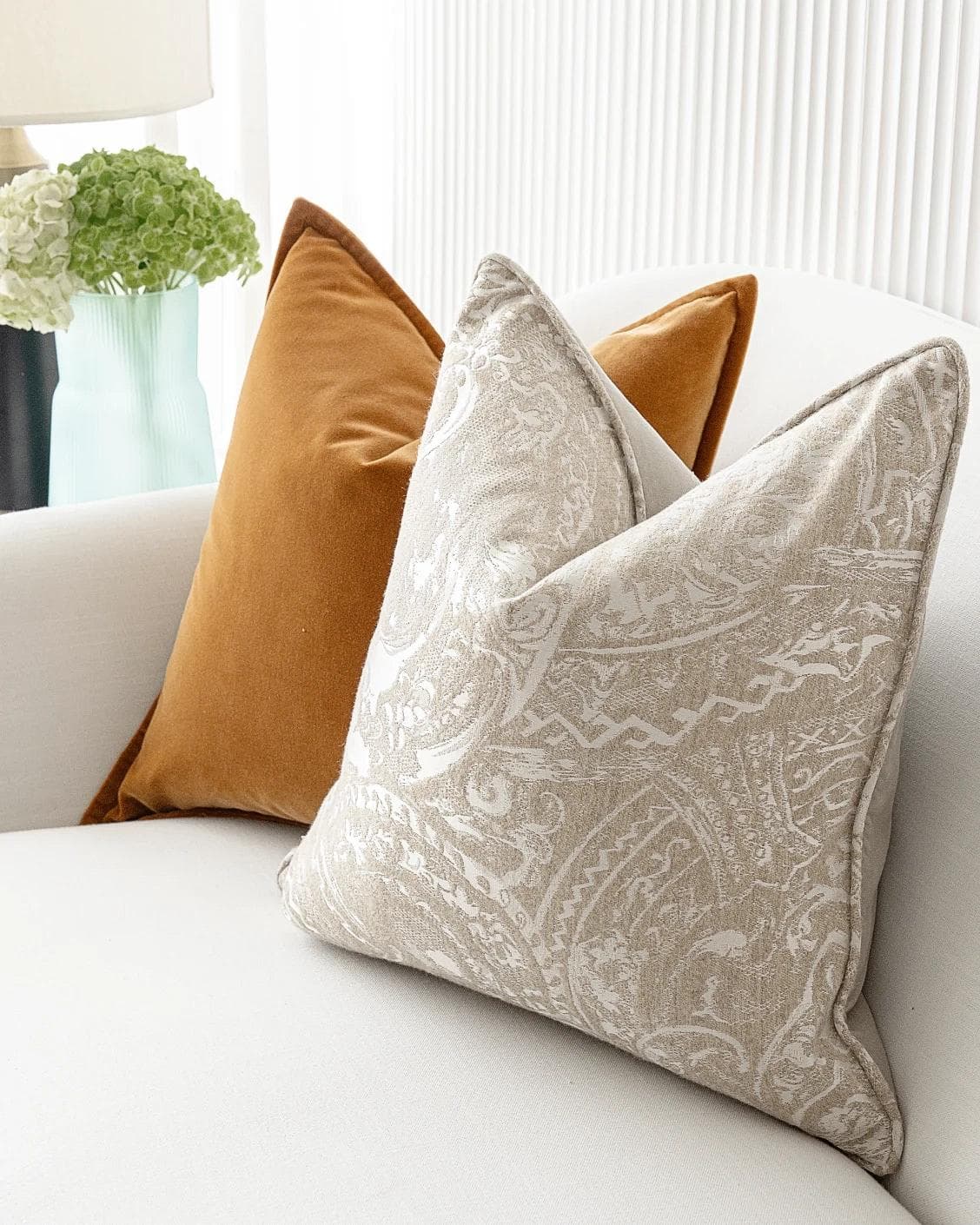 Amiya Bundle cushion in orange, beige and silver, shown in a lifestyle right view as image 7