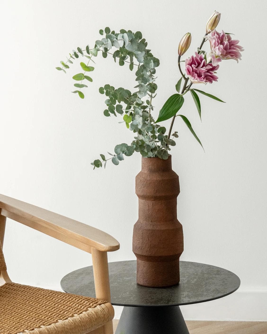 Anaya Arneson vases in rust and brown, shown in a lifestyle front view as image 4