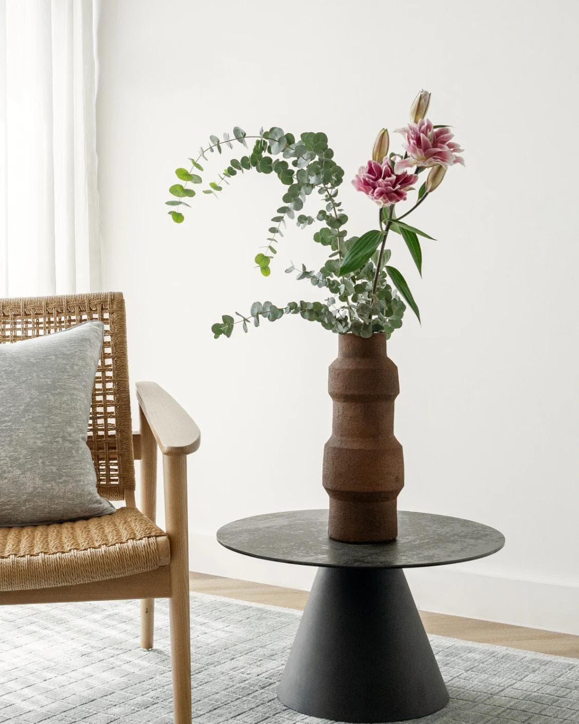 Anaya Arneson vases in rust and brown, shown in a lifestyle right view as image 2