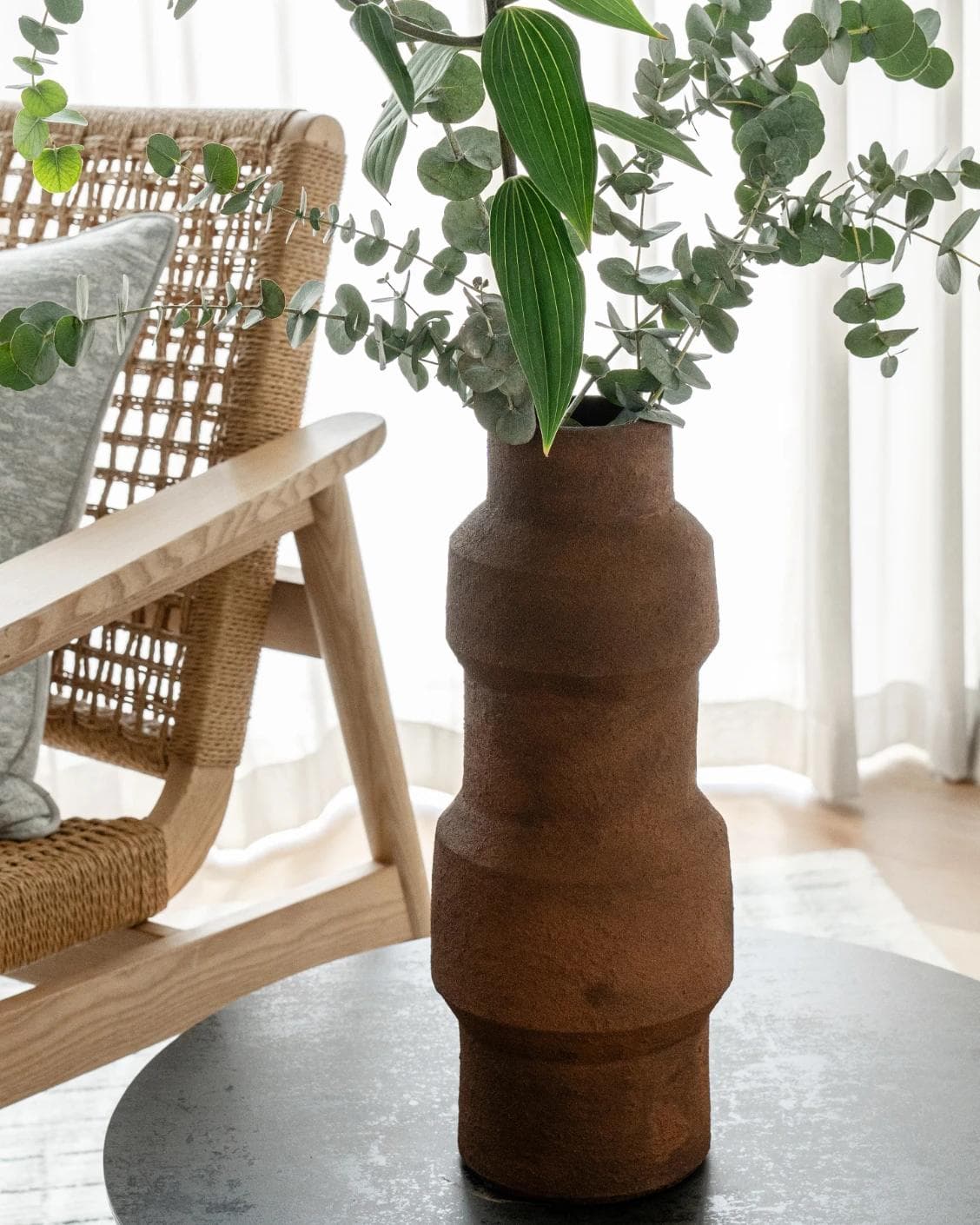Anaya Arneson vases in rust and brown, shown in a lifestyle right view as image 5
