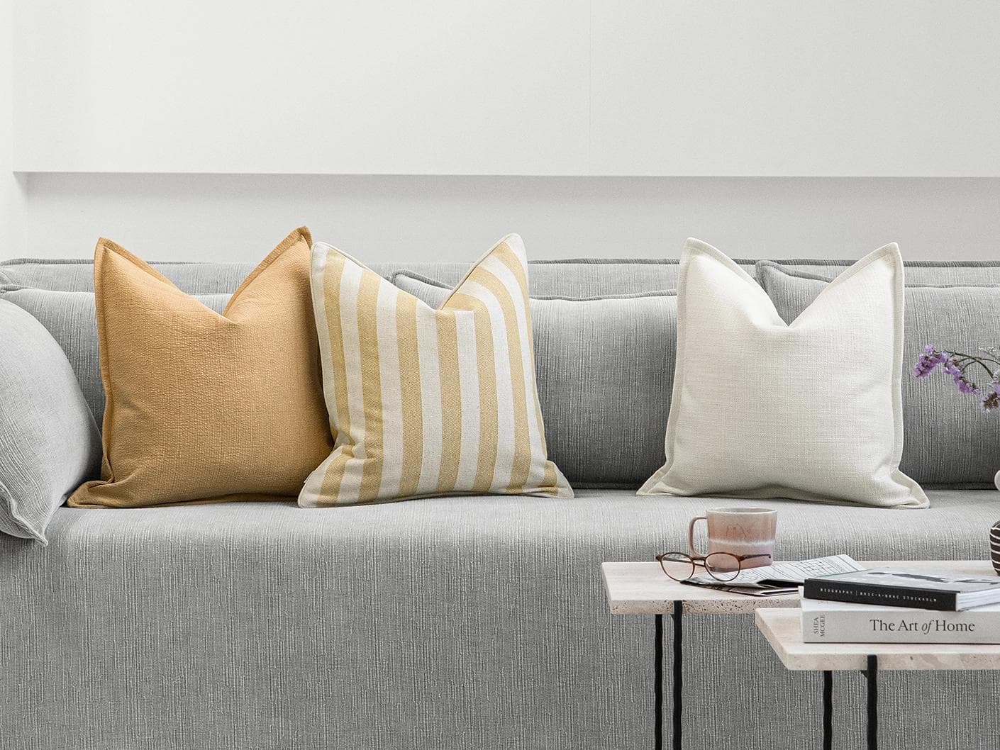 Ansh Bundle cushion in yellow and white, shown in a lifestyle front view as image 4