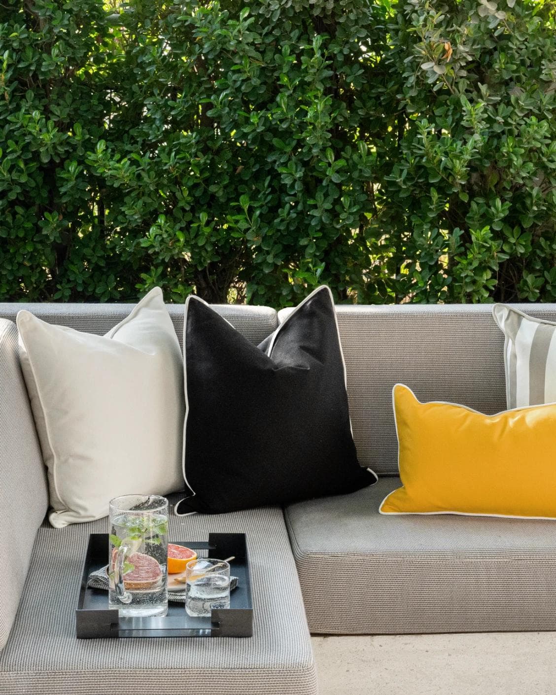 Apollo Bundle cushion in yellow, ivory, beige and black, shown in a lifestyle front view as image 4