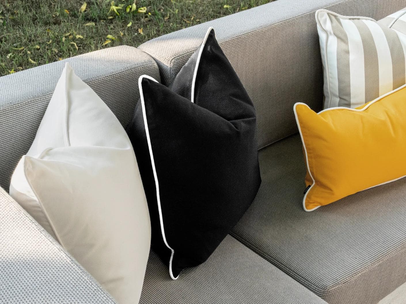 Apollo Bundle cushion in yellow, ivory, beige and black, shown in a lifestyle left view as image 6