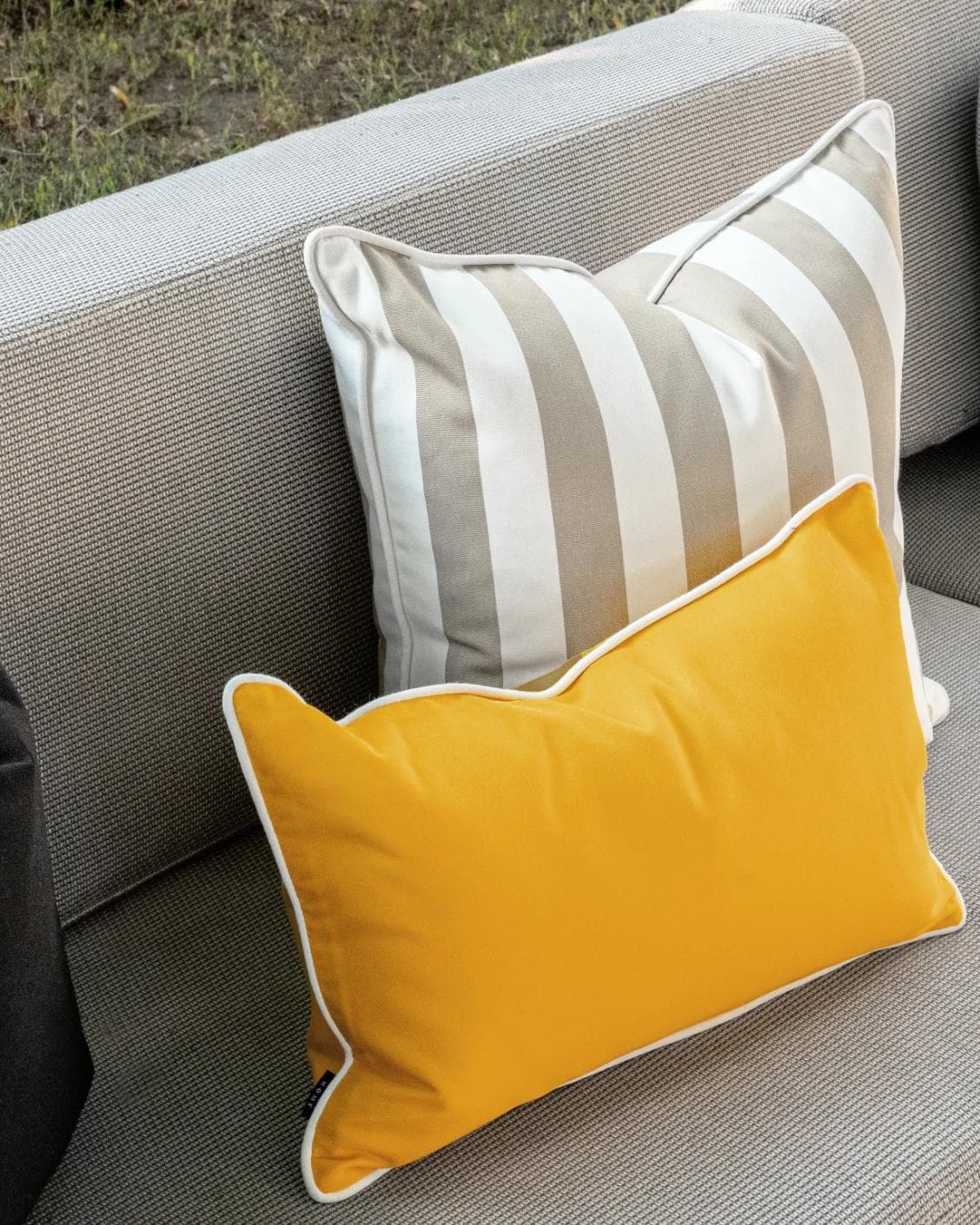 Apollo Bundle cushion in yellow, ivory, beige and black, shown in a lifestyle left view as image 7