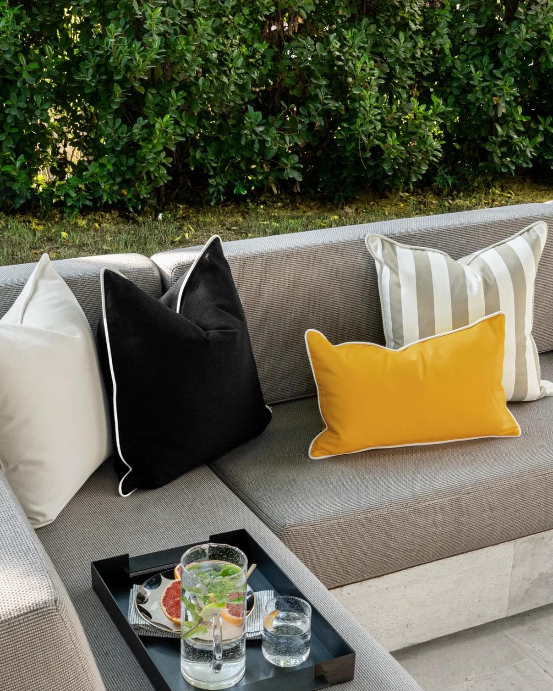 Apollo Bundle cushion in yellow, ivory, beige and black, shown in a lifestyle left view as image 5