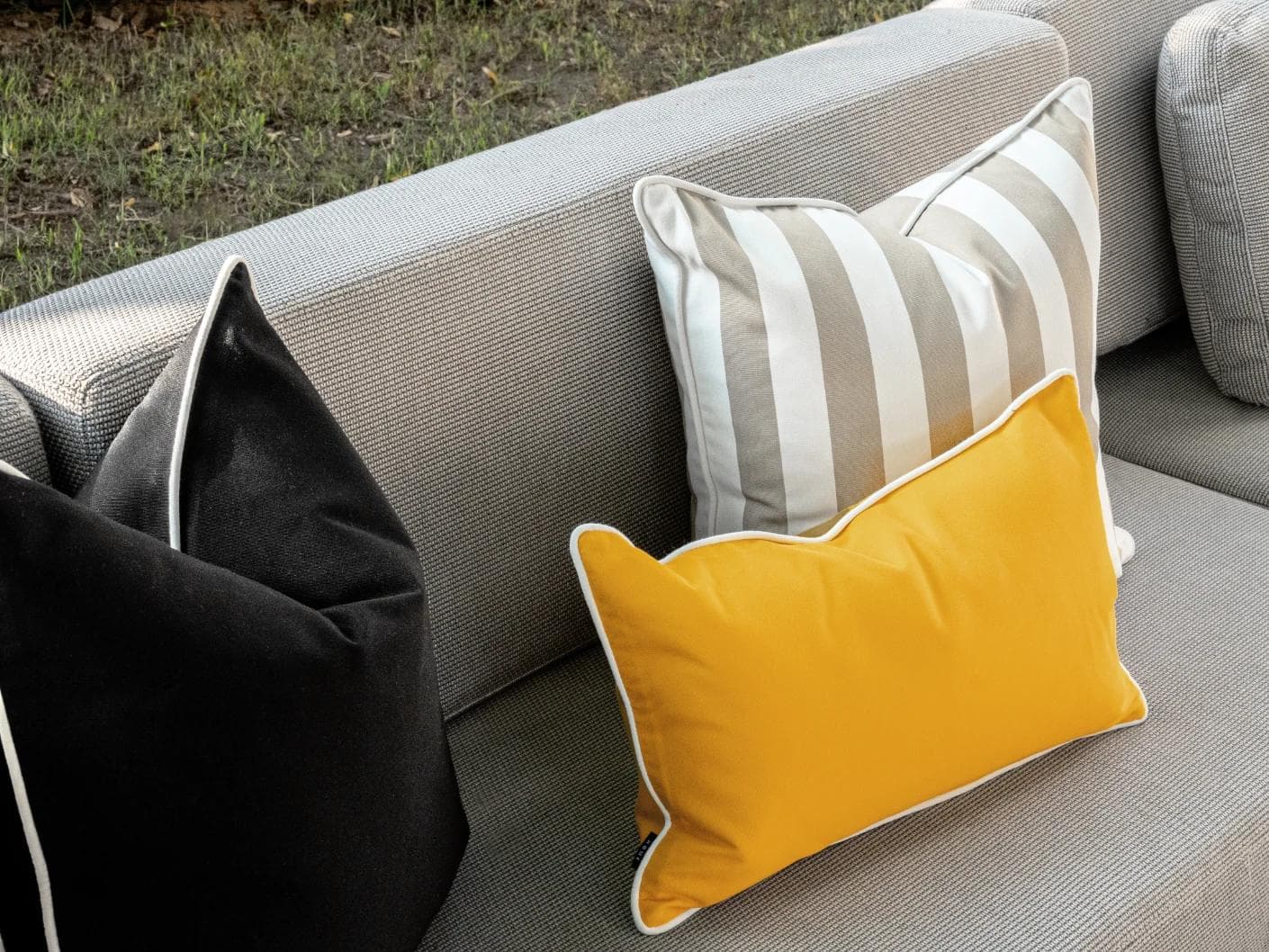Apollo Bundle cushion in yellow, ivory, beige and black, shown in a lifestyle left view as image 7