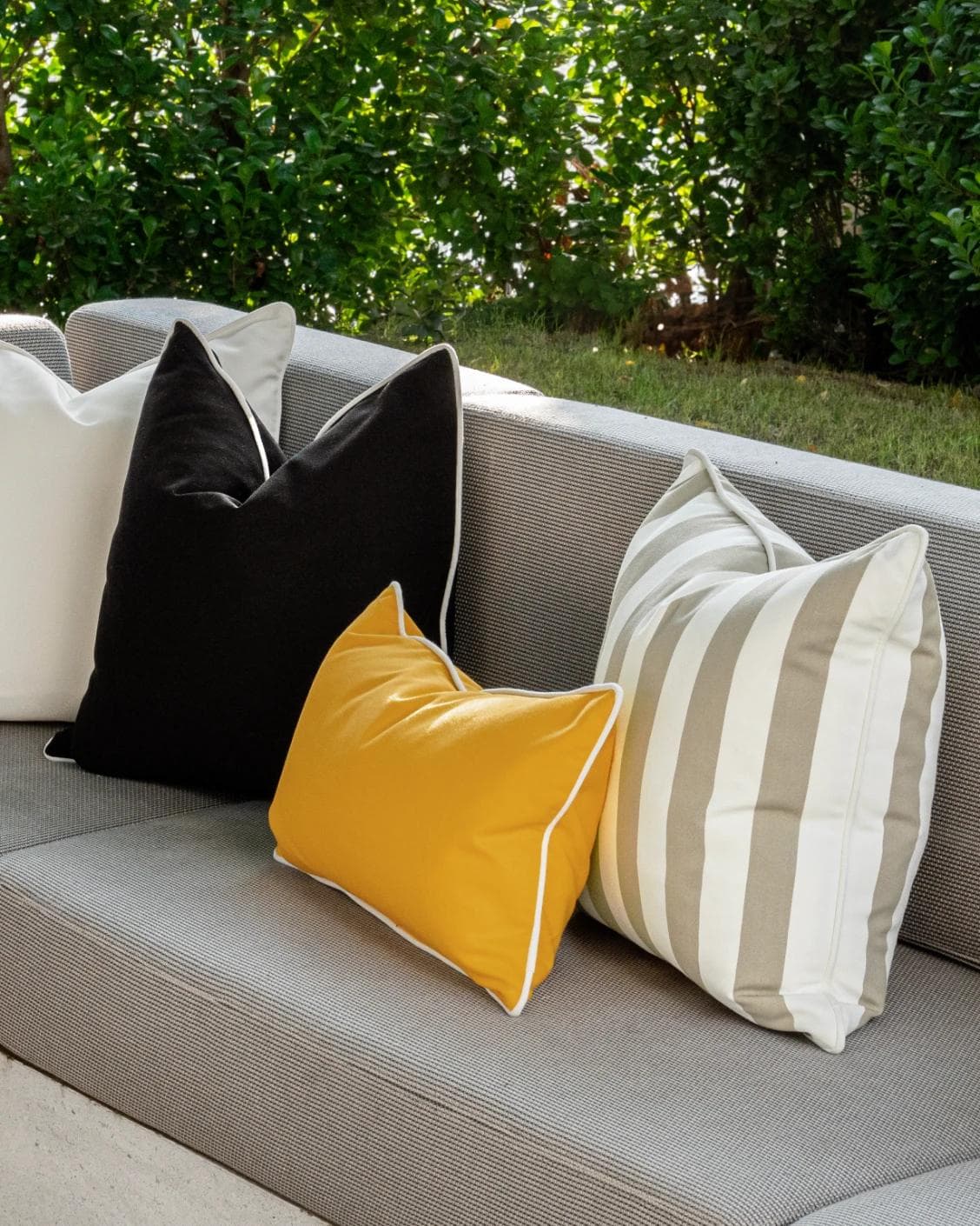 Apollo Bundle cushion in yellow, ivory, beige and black, shown in a lifestyle right view as image 8