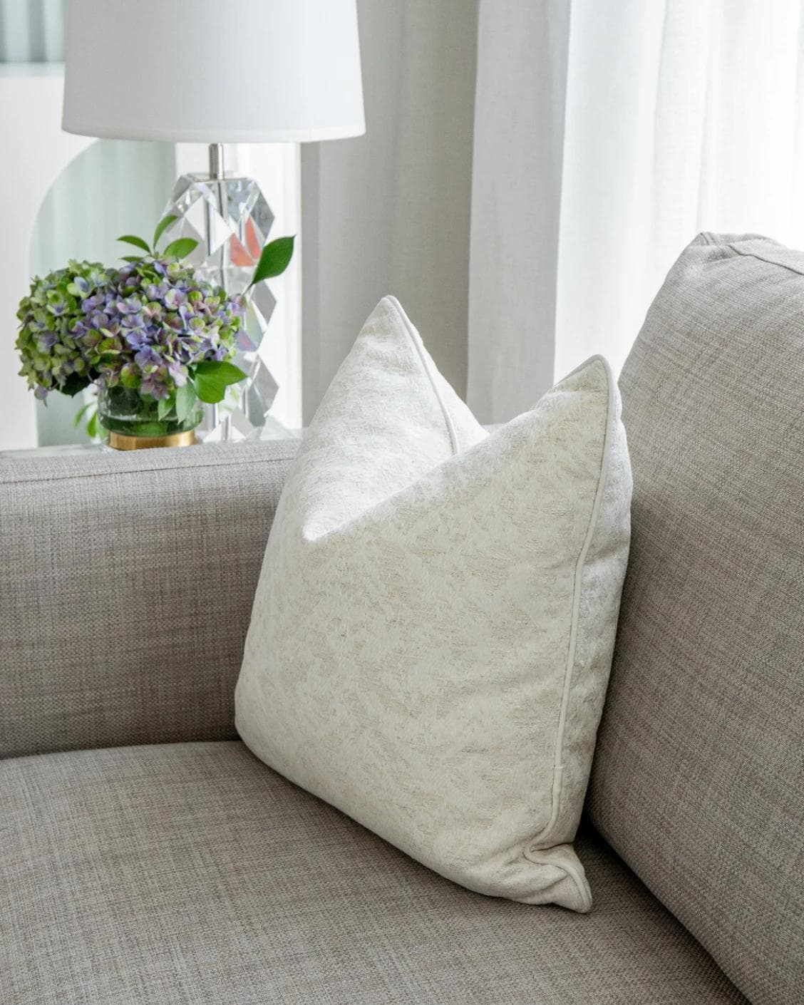 Arcie Bianca cushion in white, shown in a lifestyle right view as image 6