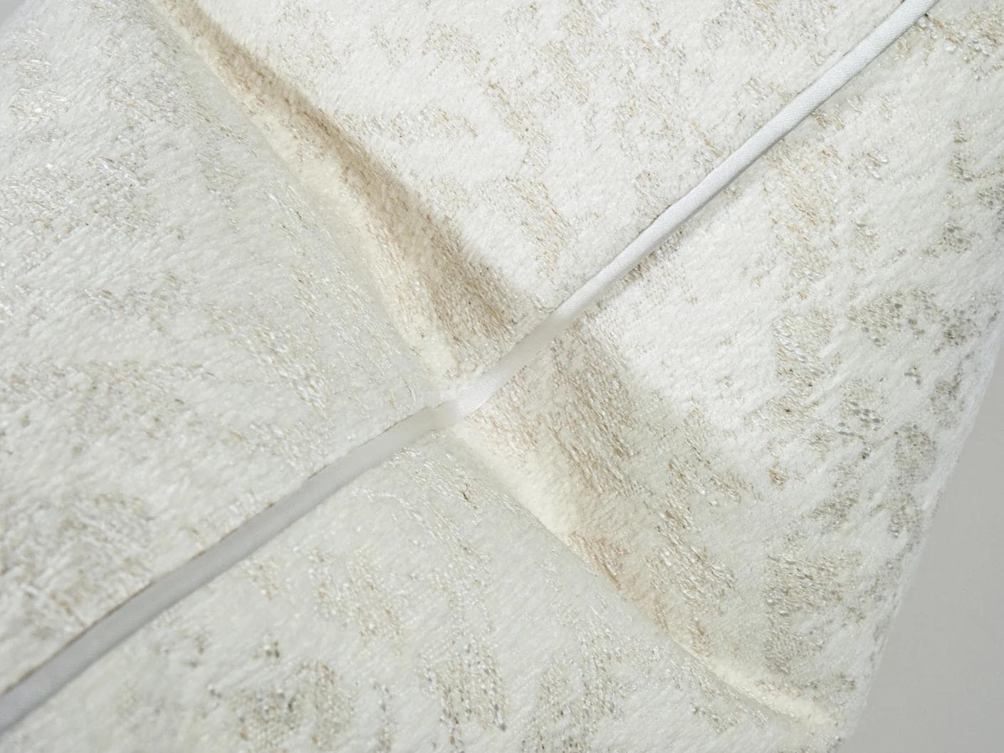 Arcie Bianca cushion in white, shown in a product close-up as image 8