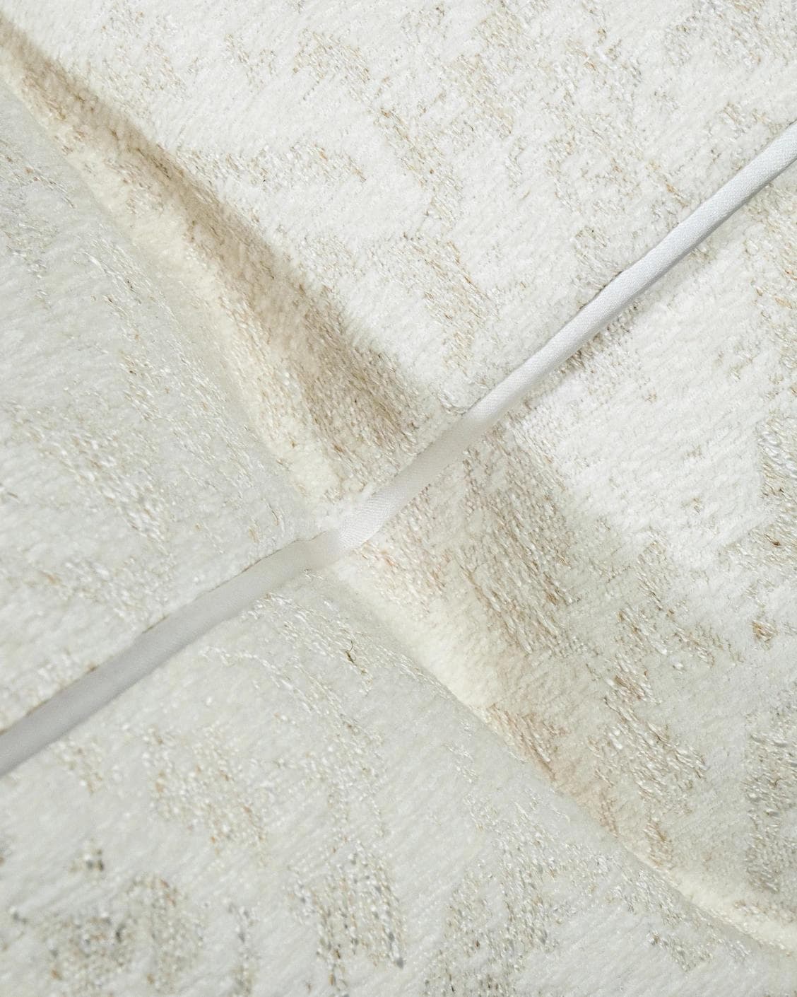 Arcie Bianca cushion in white, shown in a product close-up as image 8