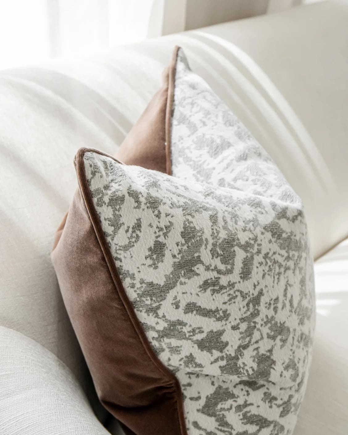 Arcie Laurent cushion in white and silver, shown in a lifestyle left view as image 5