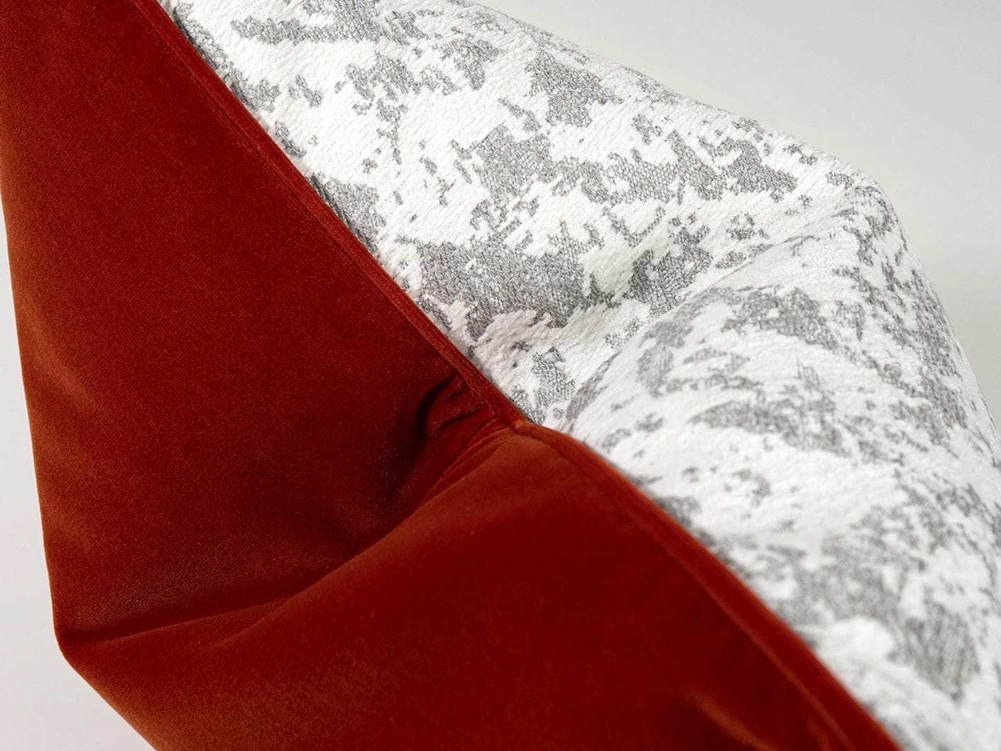 Arcie Tangelo cushion in white, grey and orange, shown in a product top view as image 3