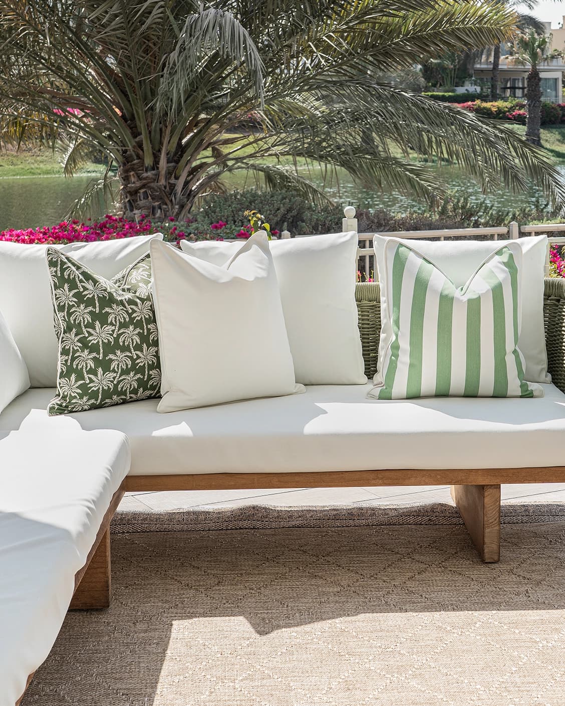Arina Bundle cushion in green and ivory, shown in a lifestyle front view as image 4