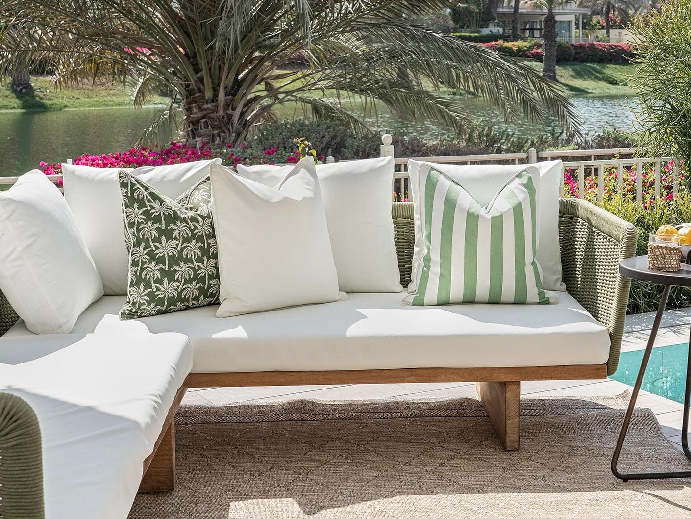 Arina Bundle cushion in green and ivory, shown in a lifestyle front view as image 4