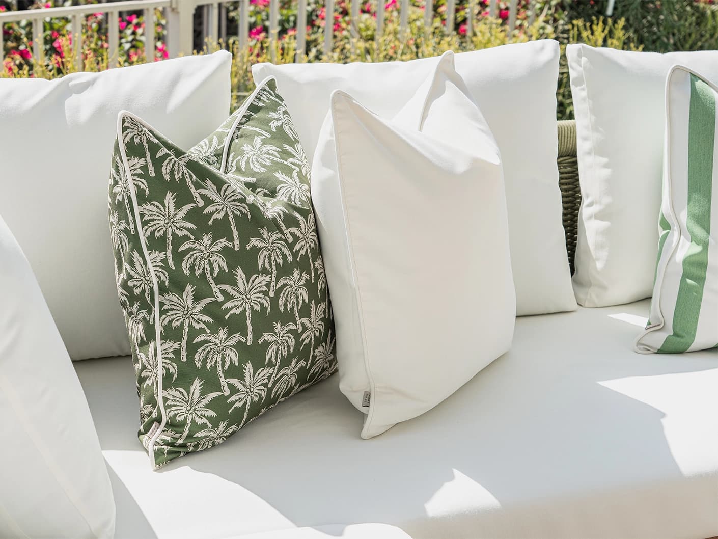 Arina Bundle cushion in green and ivory, shown in a lifestyle left view as image 5