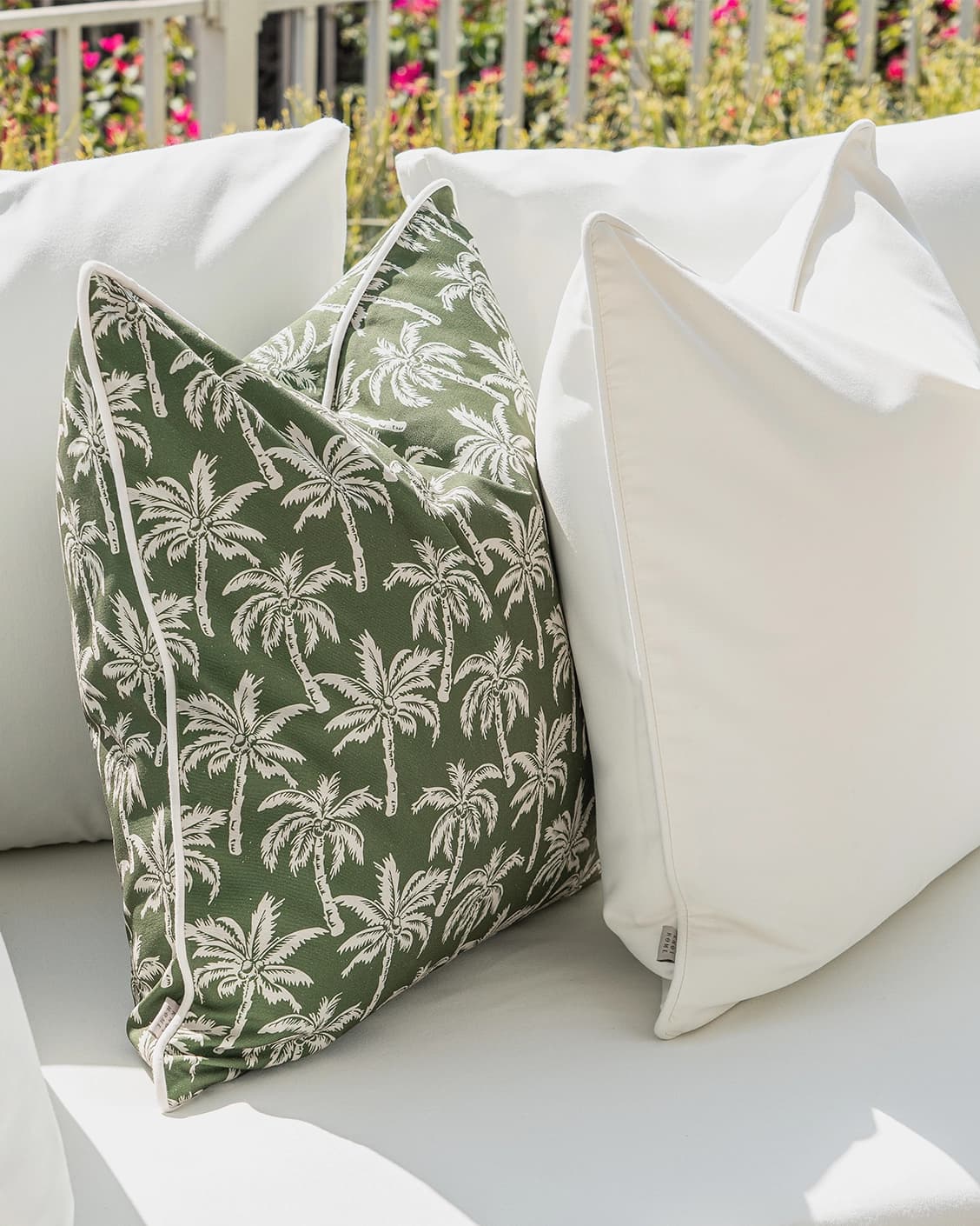 Arina Bundle cushion in green and ivory, shown in a lifestyle left view as image 5