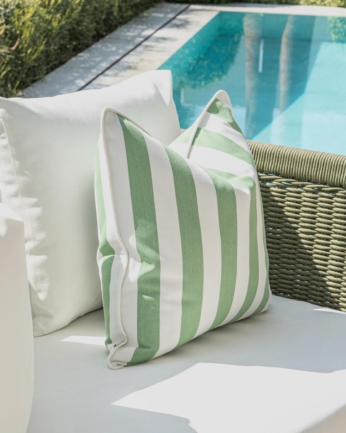 Arina Bundle cushion in green and ivory, shown in a lifestyle left view as image 6