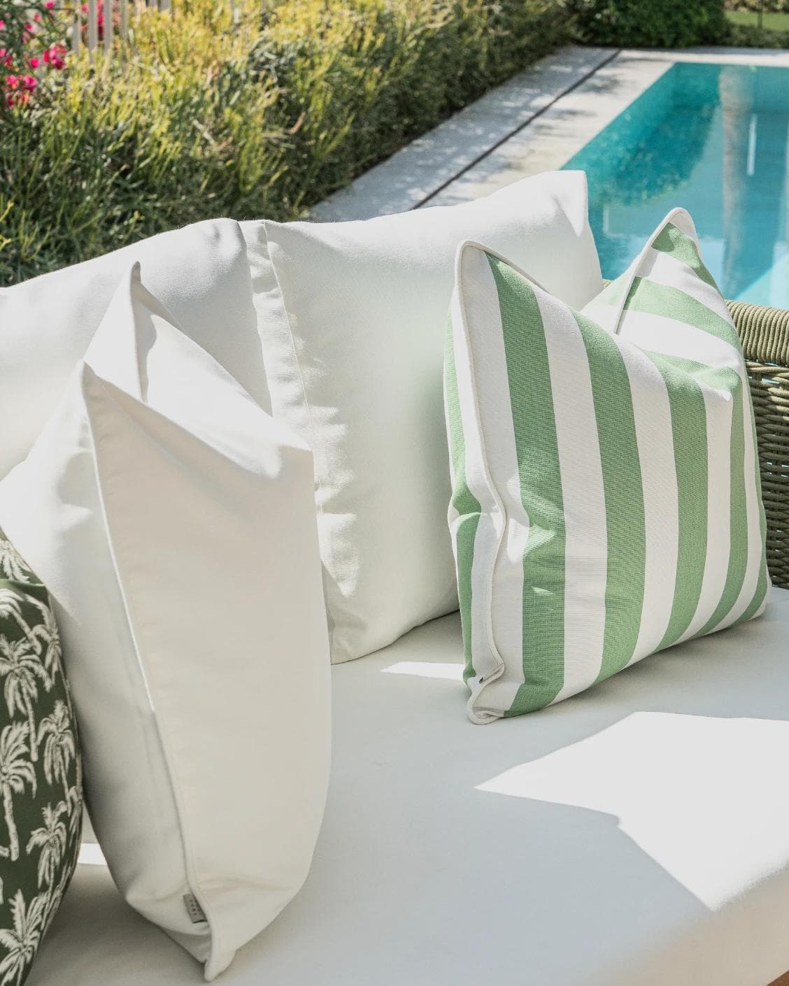 Arina Bundle cushion in green and ivory, shown in a lifestyle left view as image 7