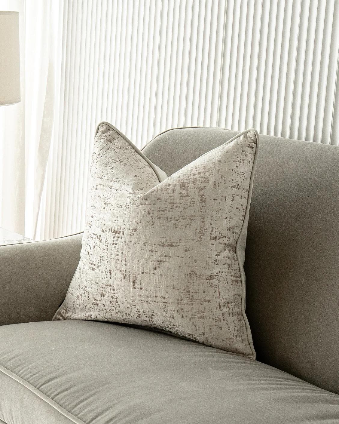 Arlo Bianca cushion in white, shown in a lifestyle front view as image 2